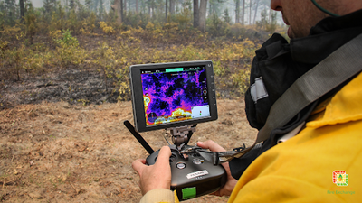 A researcher flies a custom UAV with an attached thermal camera used to map fire intensity at Tall Timbers Research Station. Photo: David Godwin, Southern Fire Exchange / University of Florida. 